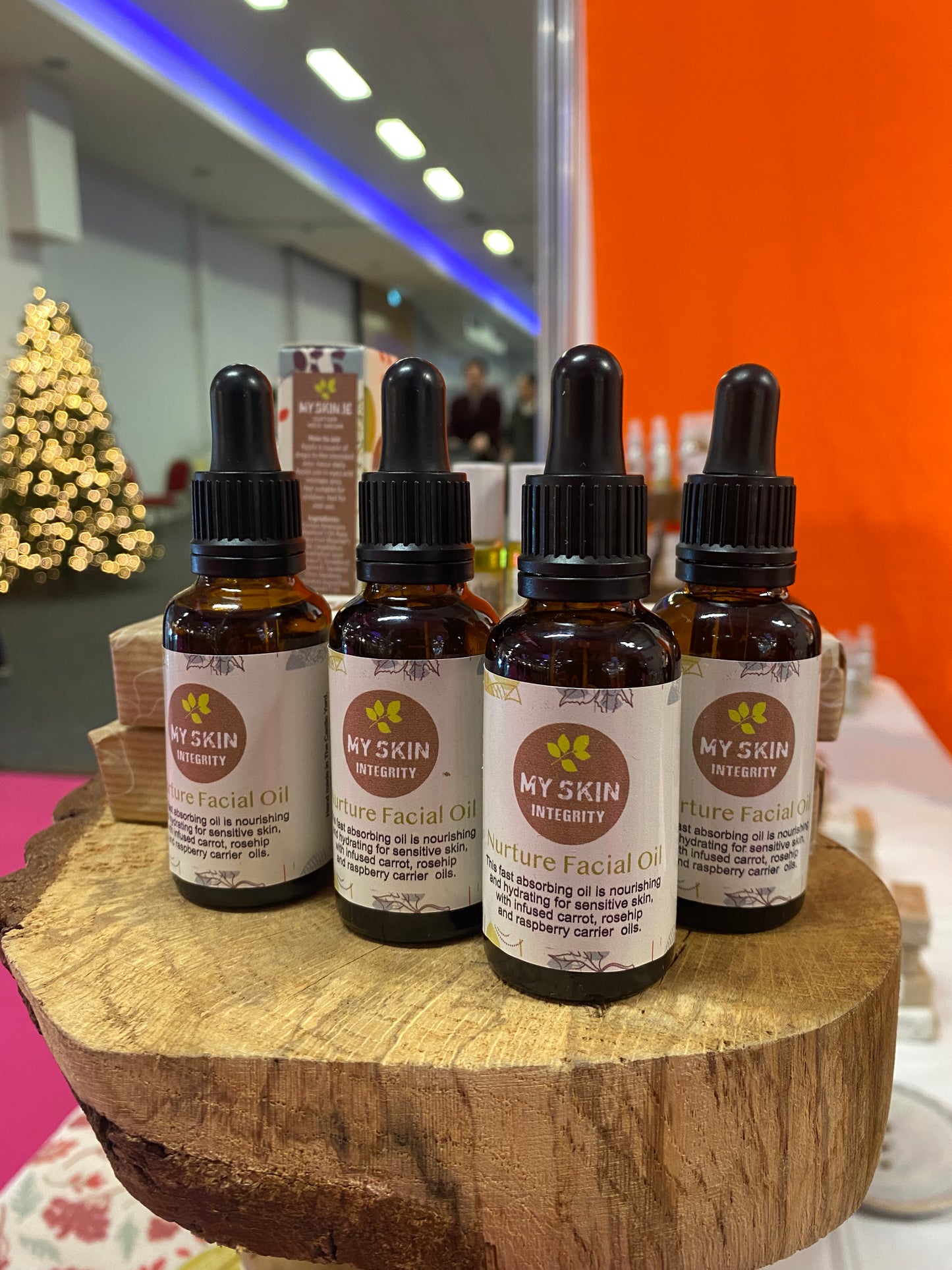Four bottles of Nurture Facial Oil